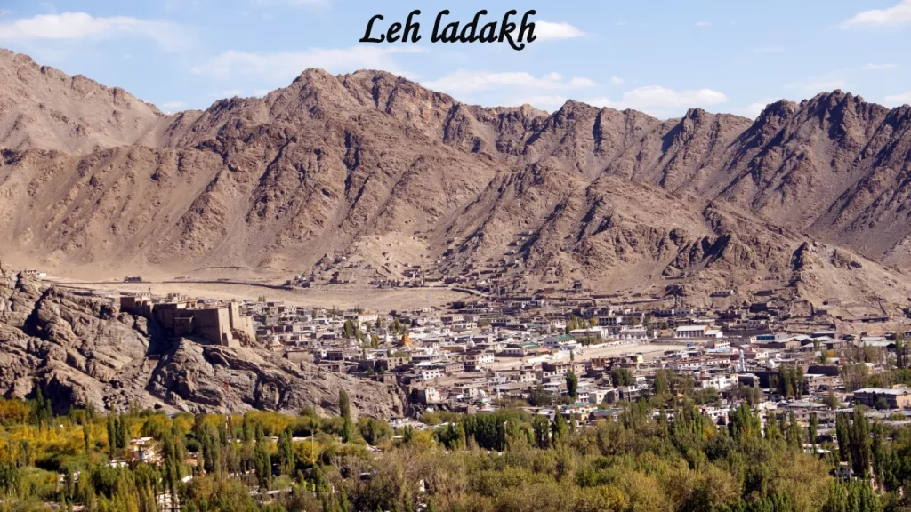 A high-altitude mountain valley town nestled below rugged peaks in Leh-Ladakh, a premier adventure spot for Indian travel.