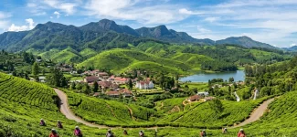 Lush green tea plantations and a scenic lake in the Nuwara Eliya hill station of Sri Lanka, a perfect highland destination to visit alongside a coastal whale watching tour.