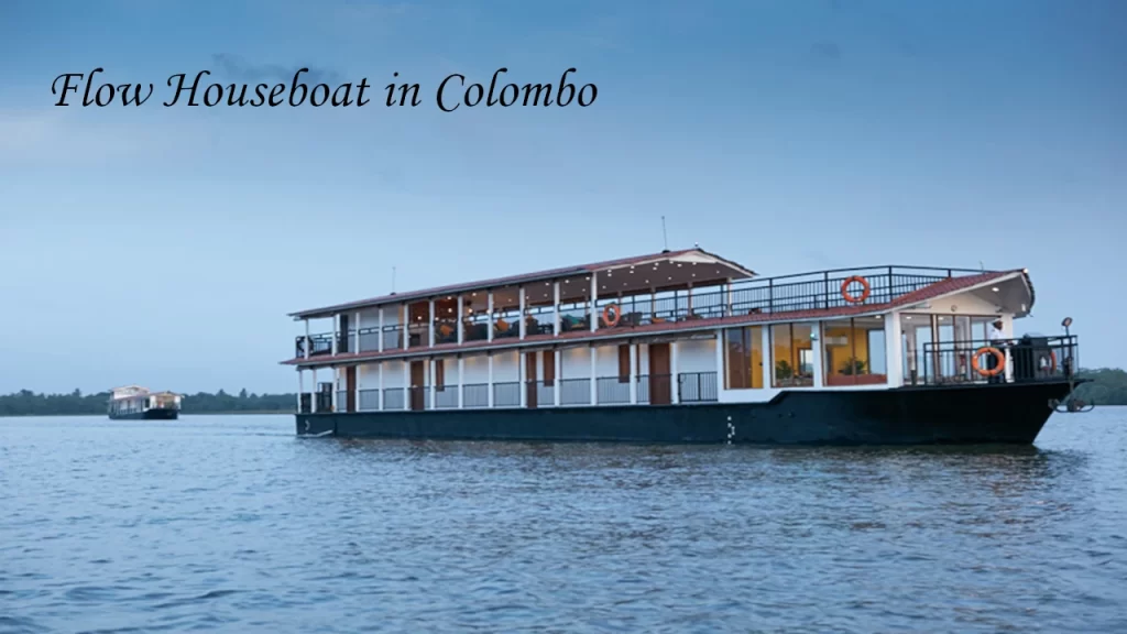 The luxury Flow Houseboat cruising on the scenic waters in Colombo, Sri Lanka, serving as a perfect base or backdrop for a day of kayaking and water sports.