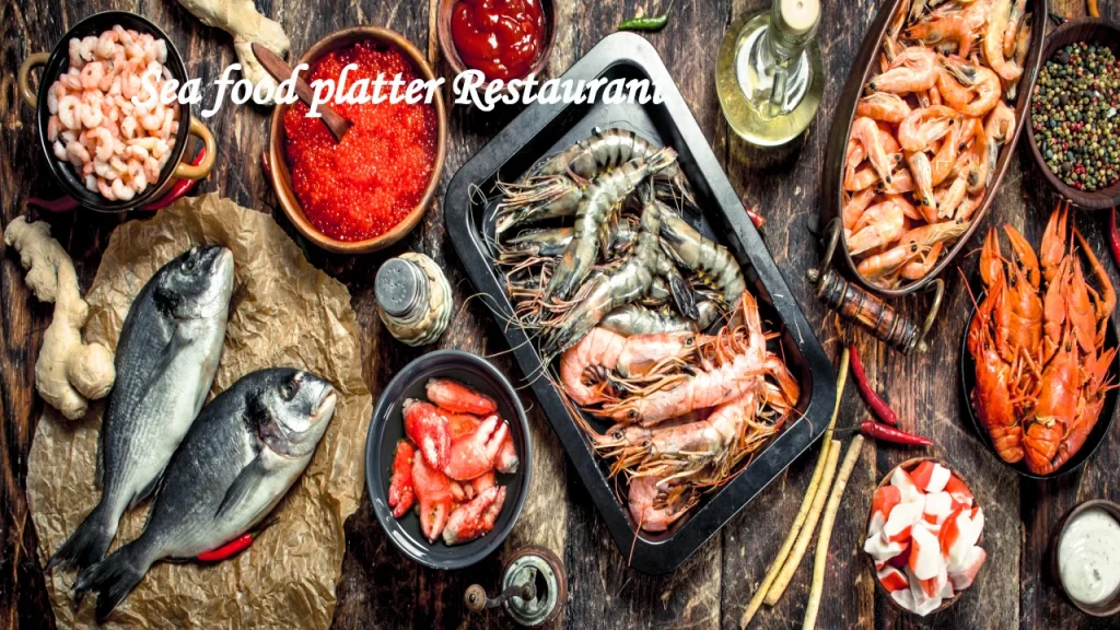 A rich variety of fresh seafood arranged on a dark wooden table, showcasing the coastal culinary options at restaurants near Bentota.