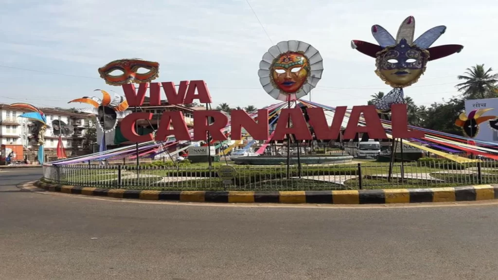 Viva Carnaval signage with colourful Venetian masks at a Goa roundabout — a festive cultural experience for Goa with Family