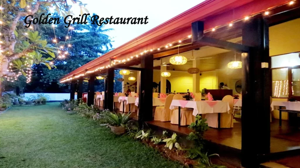 Outdoor and veranda seating area at the Golden Grill, one of the highly rated restaurants near Bentota, featuring elegant tables and warm lighting.