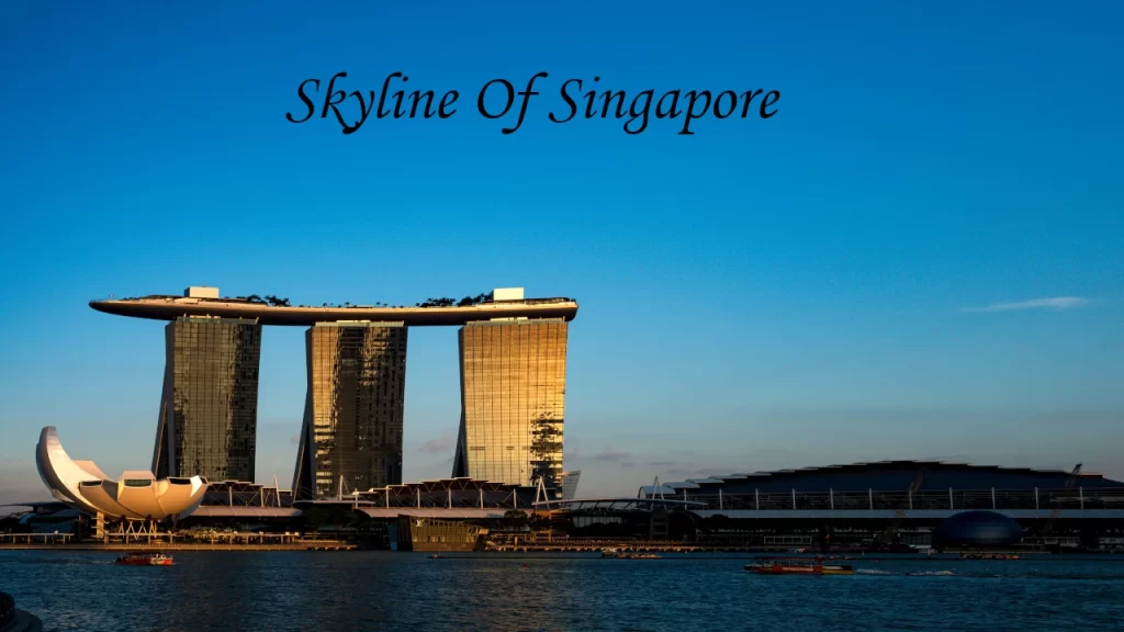 The illuminated Singapore Flyer observation wheel and glowing conservatory domes shining bright at night, reflecting top nighttime places to visit in Singapore.