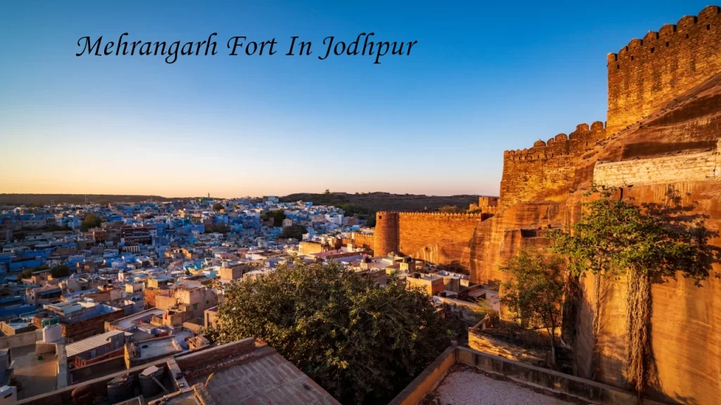 A high-angle view from the towering walls of Mehrangarh Fort looking out over the historic Blue City of Jodhpur, Rajasthan