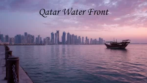 A wide view of Doha Corniche walkway with palm trees and blue waters, a popular outdoor spot among places to visit in Doha.