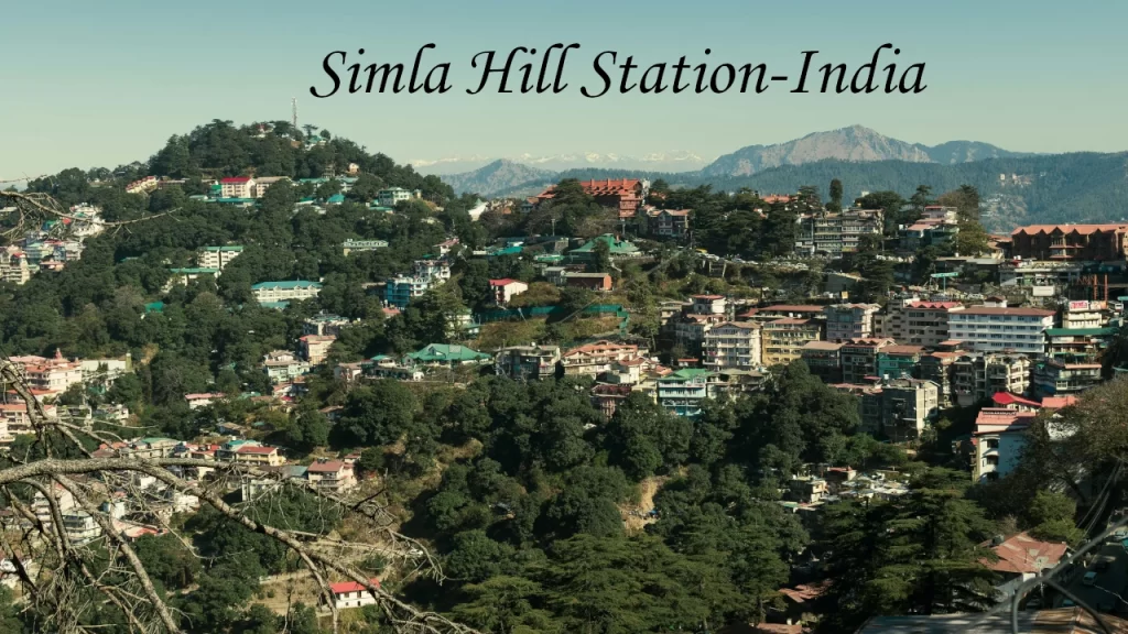 Colorful houses and resorts nestled across the lush green mountain slopes of Shimla, one of India's premier hill stations.