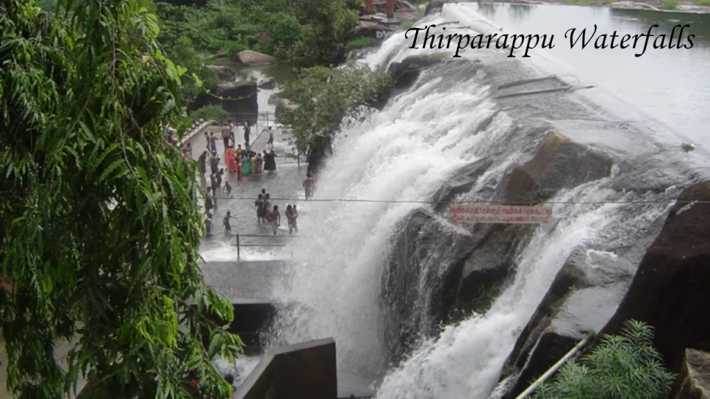 Tourists enjoying the cascading waters at Thirparappu Waterfalls, a popular nature spot in Kanyakumari Tourism.
