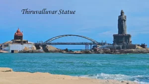 The towering Thiruvalluvar Statue and Vivekananda Rock Memorial connected by a pedestrian bridge, a signature landmark of Kanyakumari Tourism.