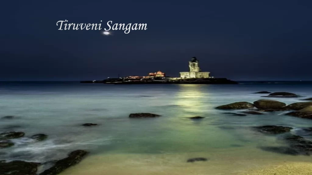 Night view of the illuminated Vivekananda Rock Memorial and Thiruvalluvar Statue at Triveni Sangam, a major highlight of Kanyakumari Tourism.