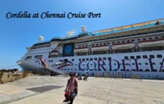 Passengers boarding a luxury Cordelia Cruises liner at the Chennai Port Cruise terminal under a clear blue sky. Cordelia Empress cruise ship docked at Chennai Port at night