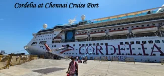 Passengers boarding a luxury Cordelia Cruises liner at the Chennai Port Cruise terminal under a clear blue sky. Cordelia Empress cruise ship docked at Chennai Port at night