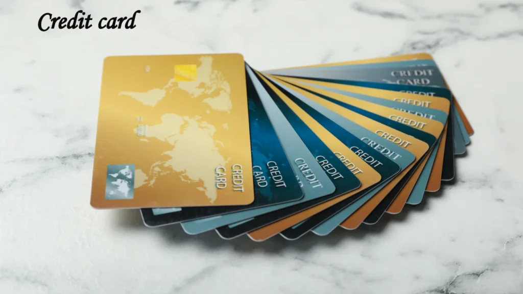 Multicolored credit and debit cards displayed in a fan arrangement on a marble surface, comparing international payment options.
