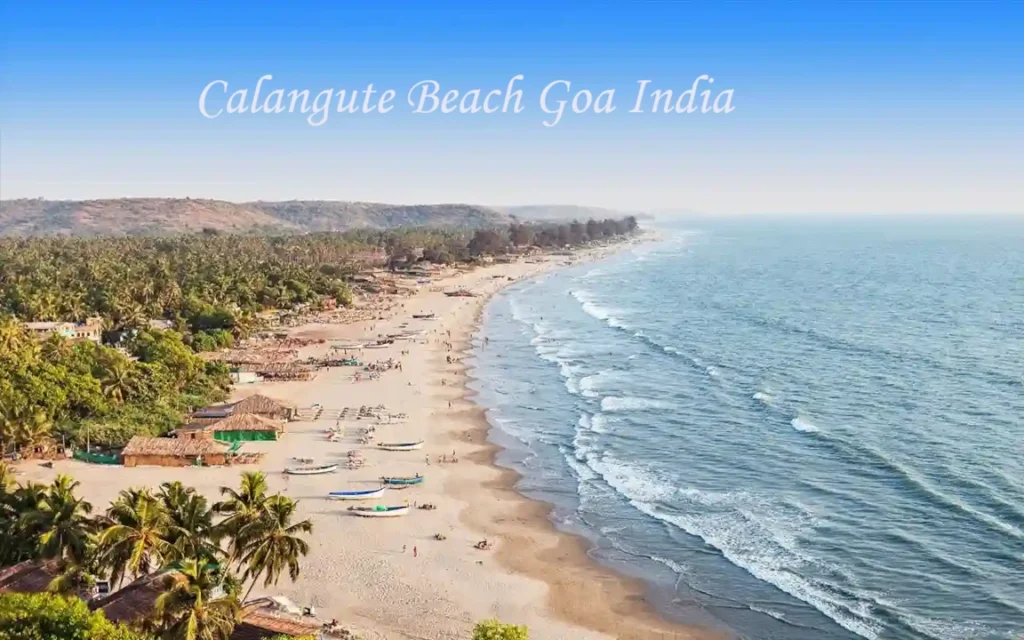 Calangute Beach in Goa with golden sandy shores, blue Arabian Sea waters, colorful beach shacks, and tourists enjoying water sports and seaside relaxation.