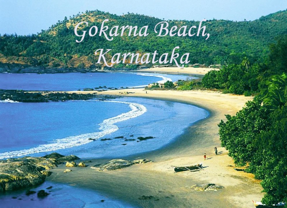 Gokarna Beach in Karnataka with golden sandy shores, clear Arabian Sea waters, rocky coastline, and lush green hills, one of the best beaches in India.