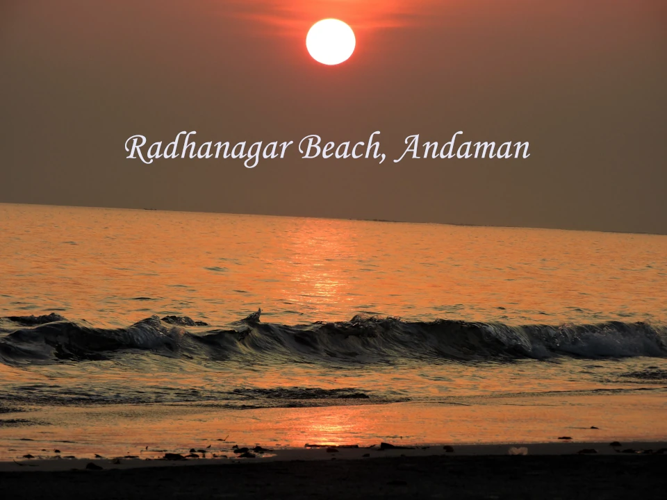 Sunset view of Radhanagar Beach on Havelock Island, Andaman and Nicobar Islands, featuring white sandy shores, turquoise waters, and a breathtaking tropical coastline.