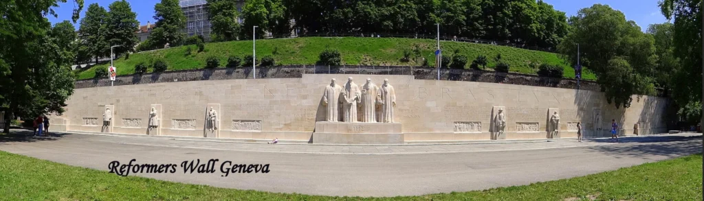 Tourist places in geneva Reformation Wall monument with statues of Protestant reformers in Geneva, Switzerland