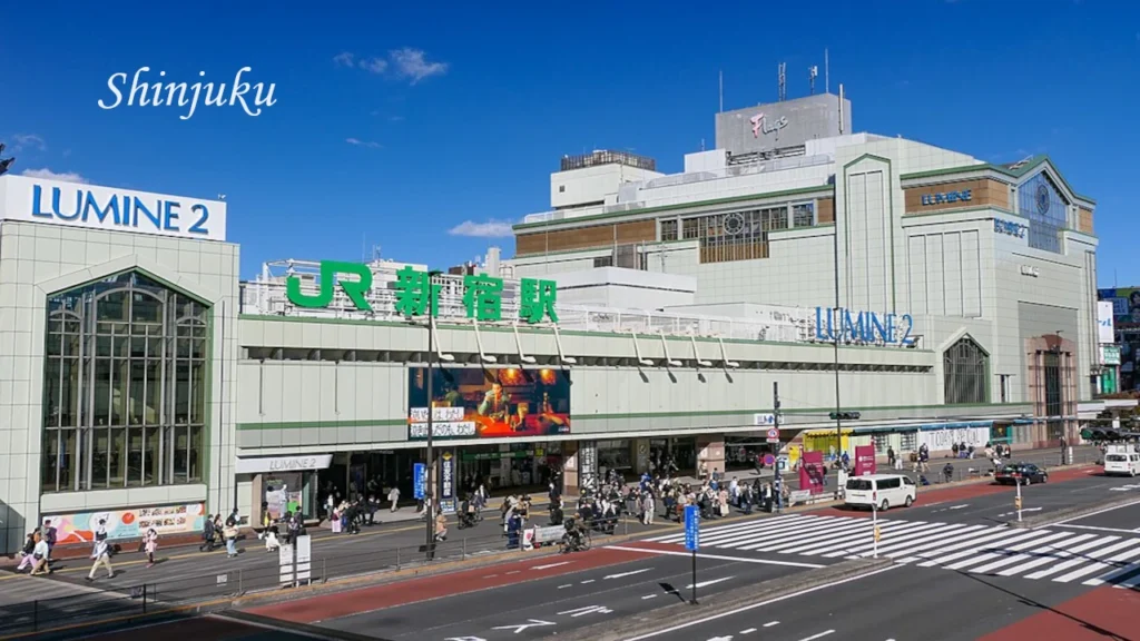 Japan Shinjuku Station with modern buildings, busy streets, and vibrant city life, featured in a Japan 7 Day Itinerary for travellers.