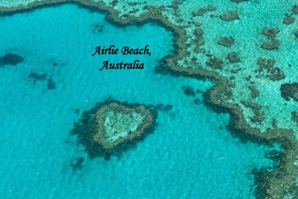 Airlie Beach Australia aerial view with turquoise waters and coral reef