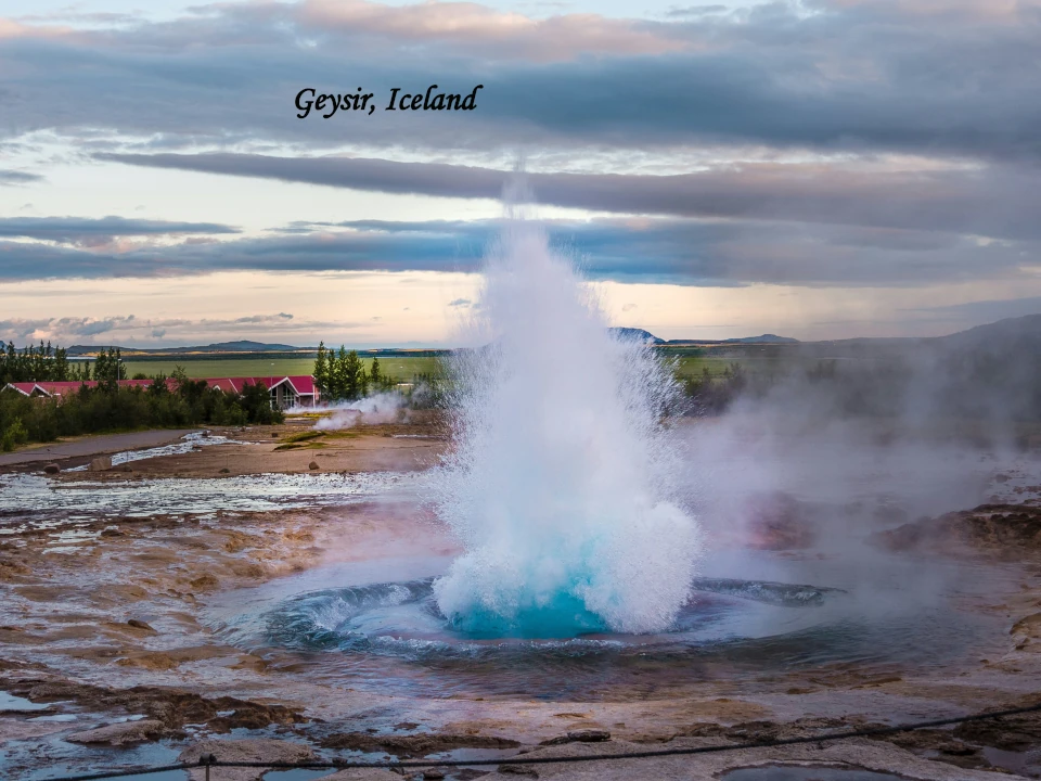 Geysir Iceland erupting geothermal geyser in scenic landscape