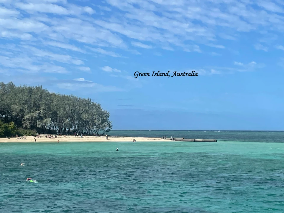 Green Island Australia with turquoise waters, sandy beach and tropical trees